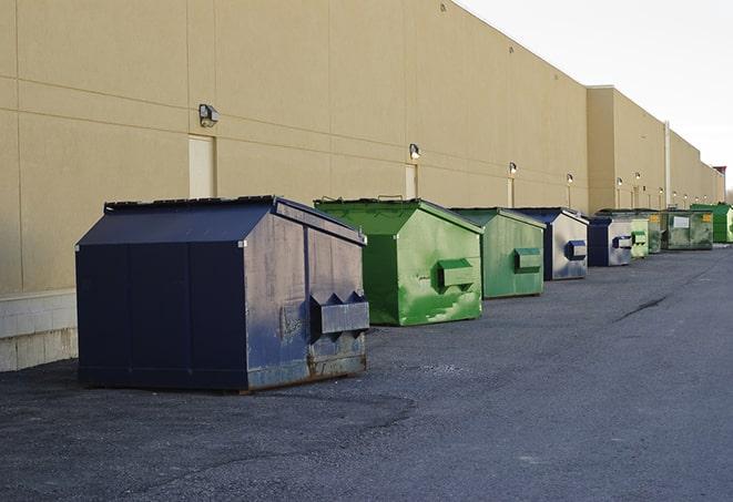 brightly colored dumpsters filled with construction waste in Angelus Oaks CA